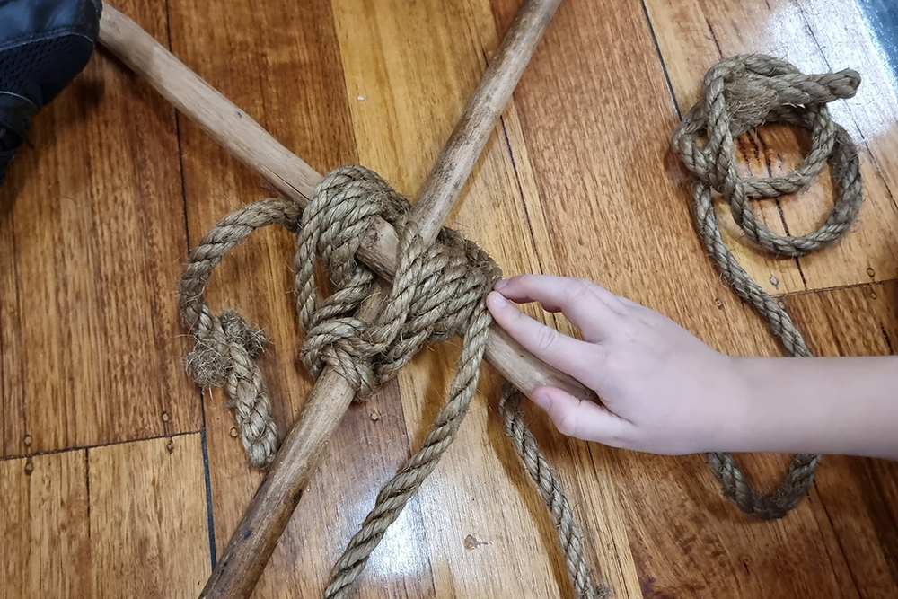 tying two poles together with a rope